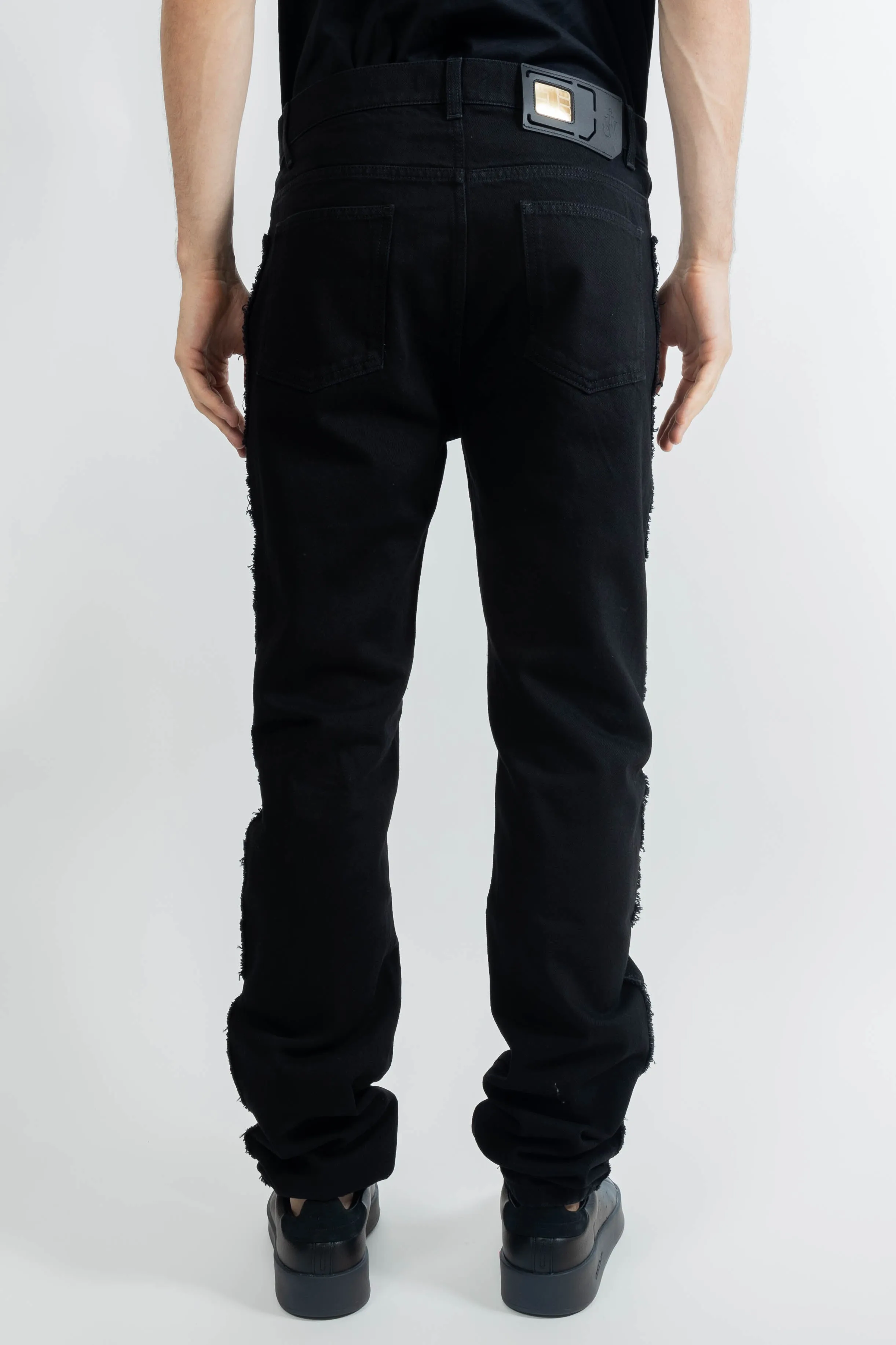 JW Anderson Twisted Slim Fit Jeans In Black